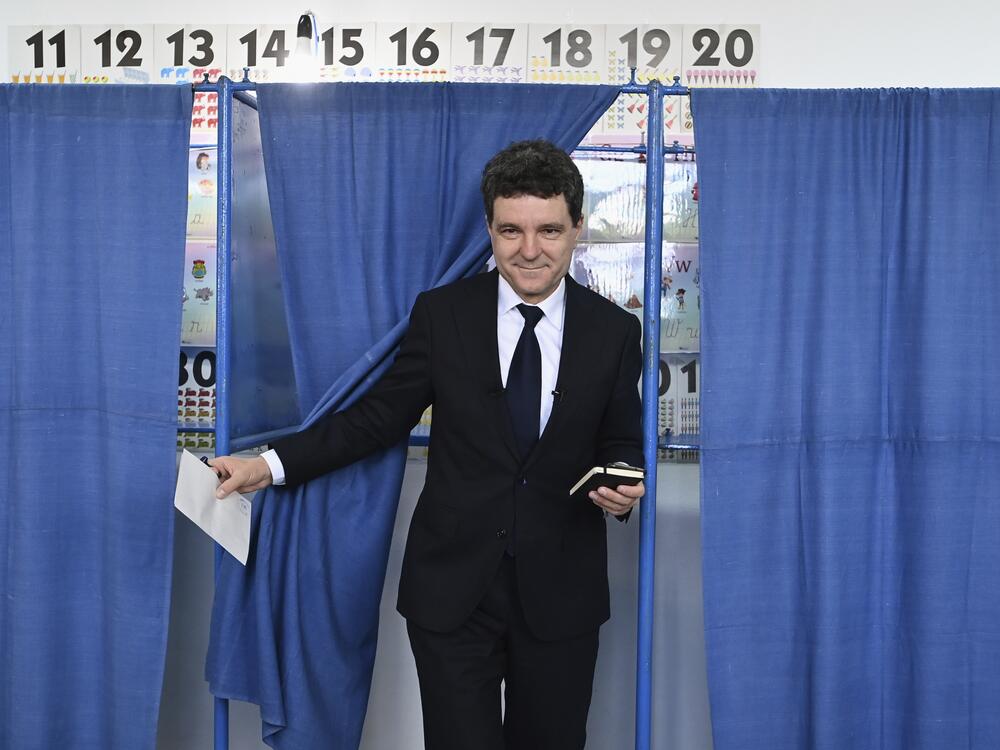 Presidential candidate Nicusor Dan exits a voting cabin before casting his vote in the second round of the country's presidential election redo in Fagaras, Romania on Sunday.