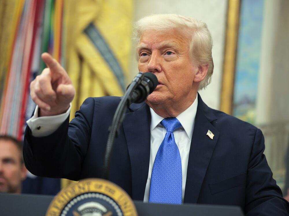 President Trump takes questions from reporters at an event in the Oval Office on May 19, 2025.