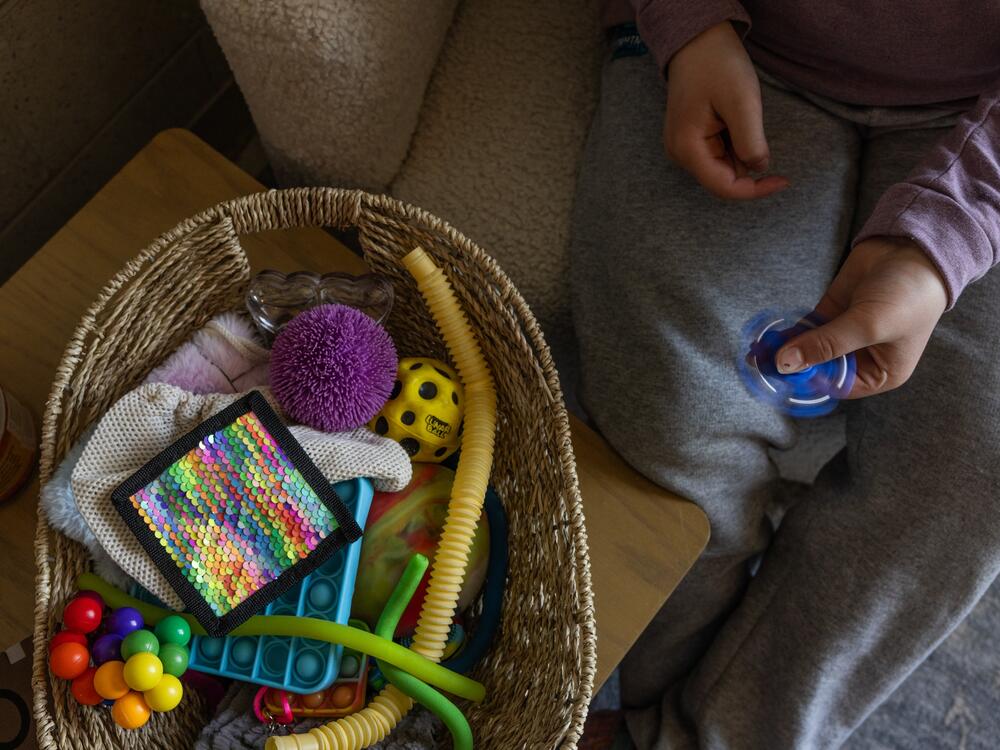 A fifth-grader at Mill Stream plays with a fidget toy in her counselor Jordan Chighali's office.