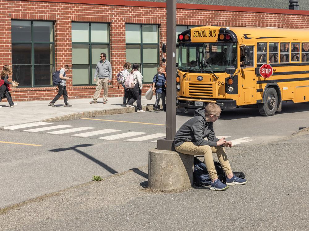 Students wait for buses in front of a school in MSAD54.