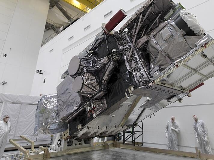 A NOAA weather satellite known as GOES-17 is prepared for launch in 2018. The satellite continuously measures weather conditions for an area that includes the West Coast of the United States.