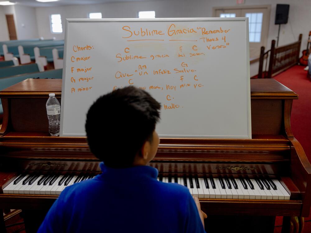 Ezdras Ambrocio Gonzalez practices a song on the piano for Sunday's church service, Saturday, May 10, 2025, in Tampa, Florida.</p>
<p>(Lexi Parra for NPR)