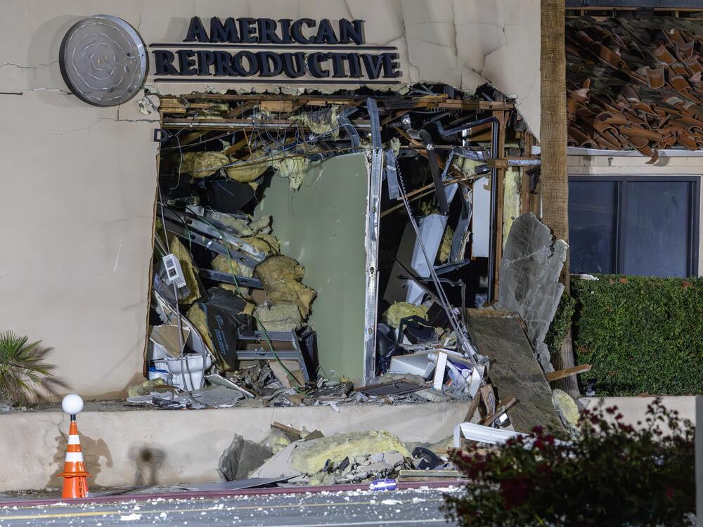 The damaged front of the American Reproductive Centers fertility clinic stands following a bomb blast on May 17 in Palm Springs, California. A suspected bomber is believed to have post a manifesto to social media before the explosion.