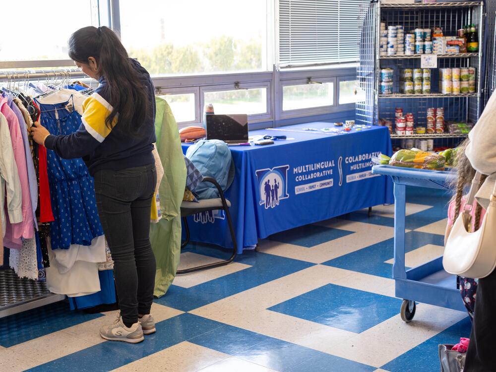 Families sort through donated clothing, jewelry and shoes at the Island Oasis.
