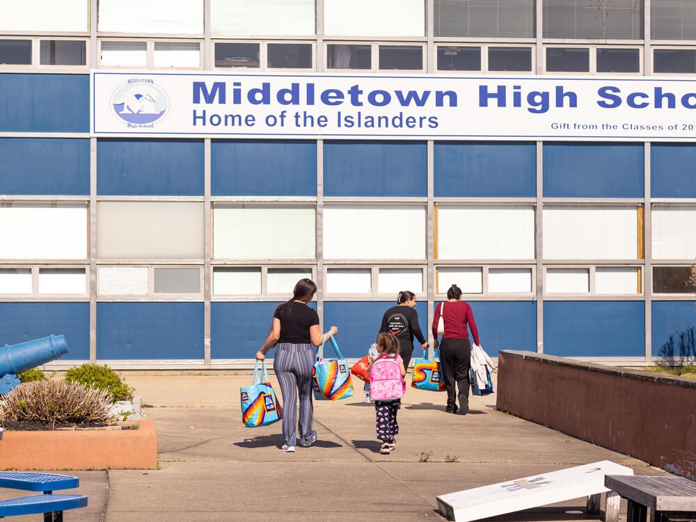 Families leave the Island Oasis with bags of food, clothing and more. The pantry, located inside Middletown High School, has a freezer full of frozen meat and seafood, a fridge with milk and eggs, pantry staples like rice and beans, and plenty of snacks.