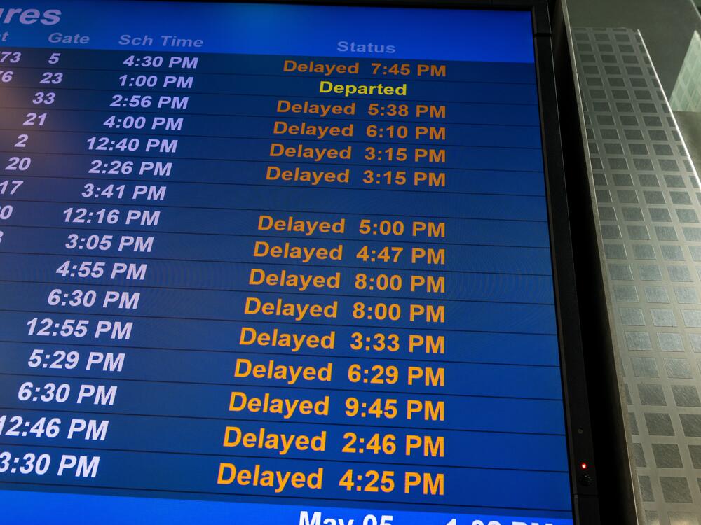 A monitor shows flight delays at Newark International Airport on May 05, 2025 in Newark, N.J. Delays and cancellations at one of the nation's busiest airports have persisted for weeks due to air traffic control outages, shortages of controllers and runway construction.