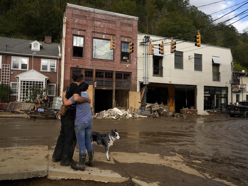Resident Anne Schneider, right, hugs her friend Eddy Sampson as they survey damage caused by Hurricane Helene in Marshall, N.C. in 2024. Hurricanes cause billions of dollars of damage each year in the U.S. Most deaths from hurricanes are related to flooding, and many occur far from the coastline when heavy rain causes dangerous flash floods.