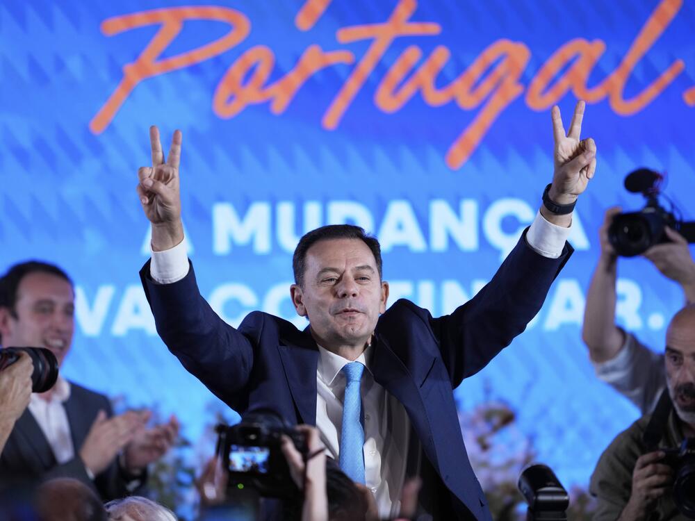 Incumbent Prime Minister and leader of the center-right Social Democratic Party Luis Montenegro gestures while addressing his supporters following Portugal's general election, in Lisbon on Monday.