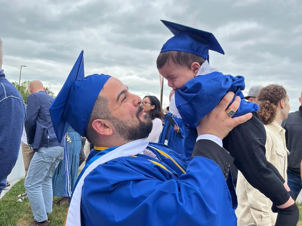 Jean Paul Al Arab and his son, 6-month-old Mtanos, celebrate the elder Al Arab's graduation from the University at Buffalo.