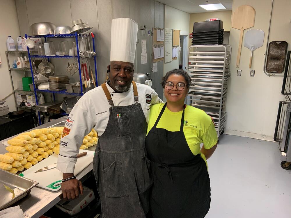 Keith Taylor and daughter Samantha Taylor stand in the kitchen of his catering business, Zachary's BBQ & Soul in Collegeville, Pa.