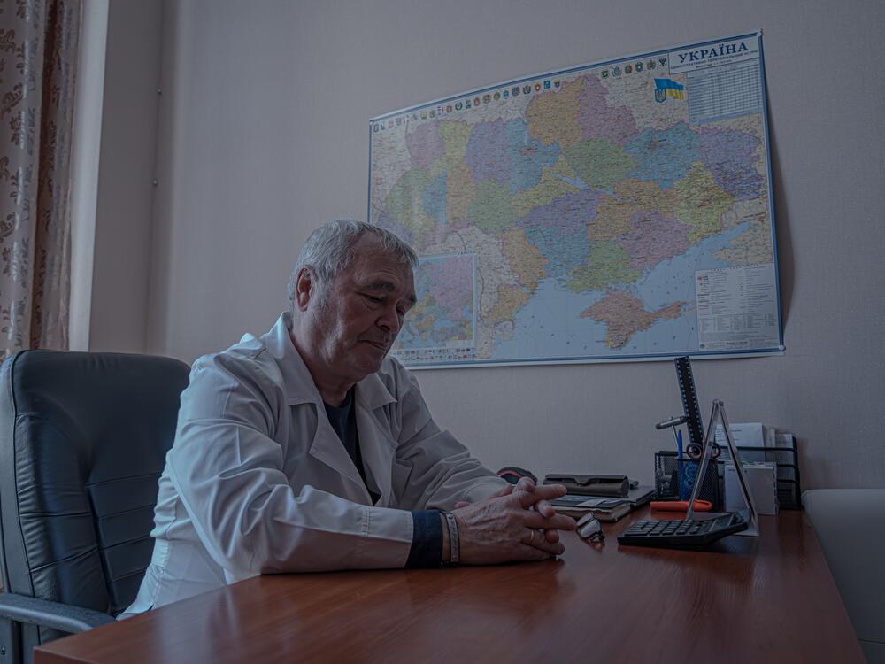 Volodymyr Ivanenko, 69, director of Sloviansk City Clinical Hospital  in his office in front of the map of Ukraine.