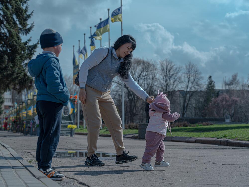 Olena Hunchenko with small children in the center of Sloviansk city, Donetsk region.