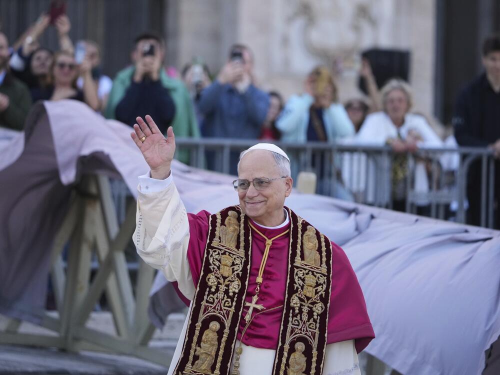 Pope Leo XIV waves upon his arrival at the St. John Lateran Basilica in Rome on Sunday.