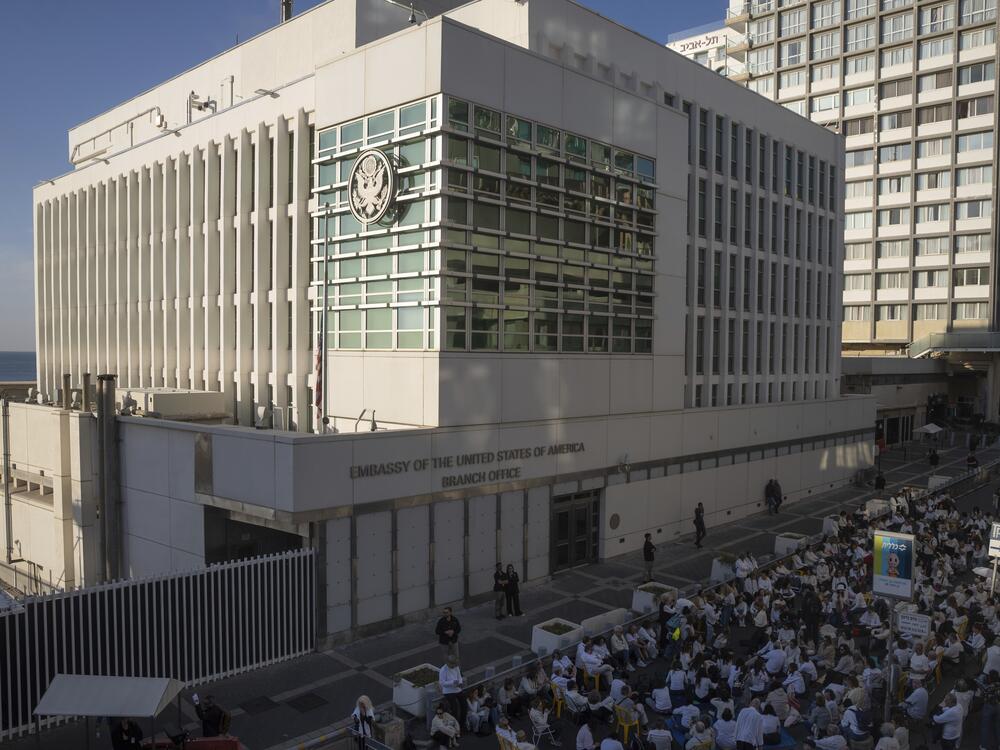 Activists sit in front of the U.S. Embassy branch office in Tel Aviv, Israel, during a protest on Jan. 8, 2025.