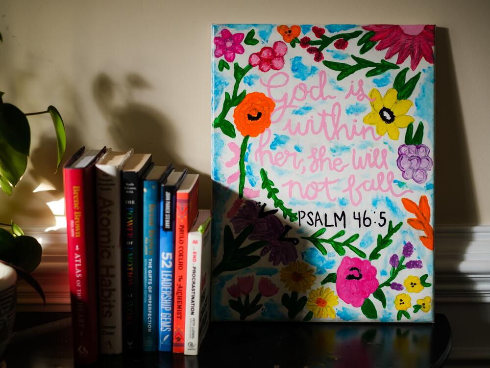 Byrdsong Williams's home office features a painting of a favorite Bible verse made by her daughter.