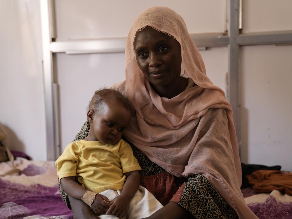 Alawiya Zakaria and 1-year-old Sabba. The daughter is painfully thin but now doing better from treatment at Al-Buluk Pediatric Hospital in Omdurman, a city across the White Nile River from Khartoum, the capital city where Zakaria lives. There are currently no functioning hospitals in Khartoum, a toll of the war in Sudan.