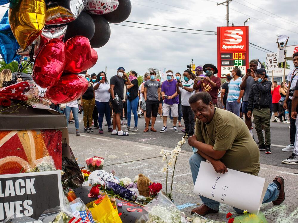 A man visits a makeshift memorial honoring George Floyd on May 26, 2020 in Minneapolis.