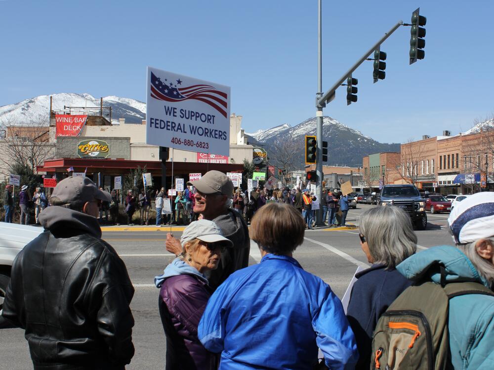 Hundreds of people join a protest in downtown Hamilton, Mont., in April supporting the work of federal employees as President Donald Trump oversees efforts to restructure the nation's government. Federal scientific research and forestry work are part of this small town's economic bedrock.