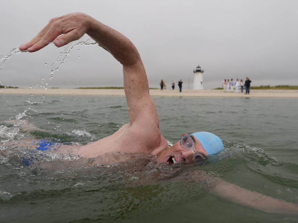 Endurance swimmer Lewis Pugh swims near the Edgartown Harbor Light on Thursday in Edgartown, Mass.