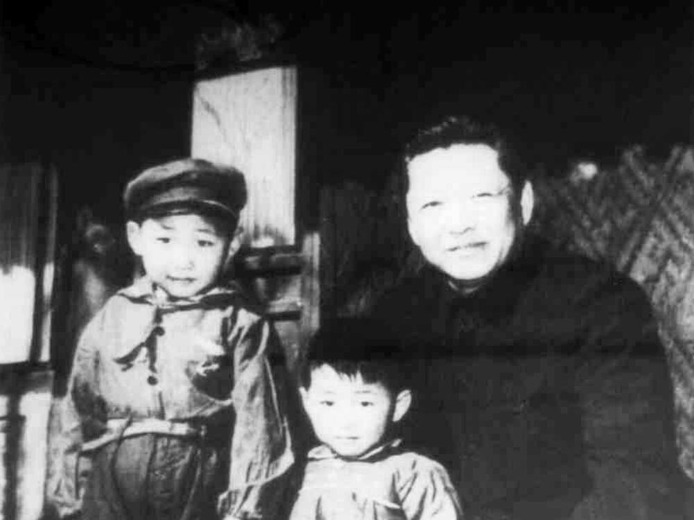 Xi Jinping, left, with his father Xi Zhongxun in 1958.