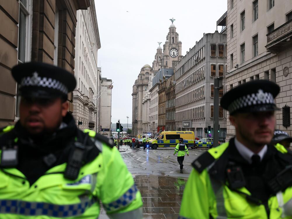 A large emergency service presence is pictured in Liverpool, England, on Monday, after a car collided with pedestrians during a parade.
