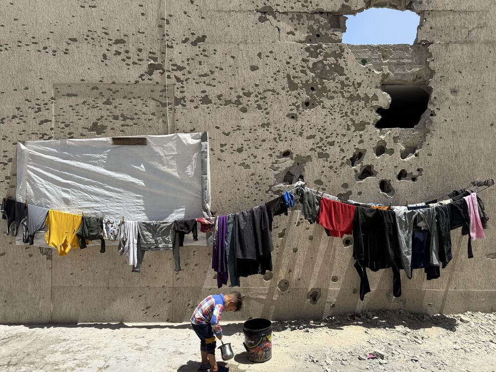 A boy plays near the encampment in Gaza City on May 25, 2025.