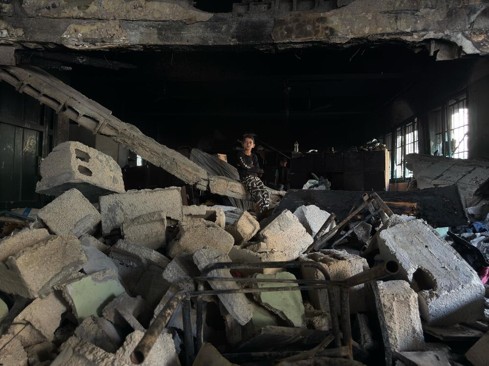 A boy sits on the rubble left from the Gaza City School airstrike on May 27, 2025.