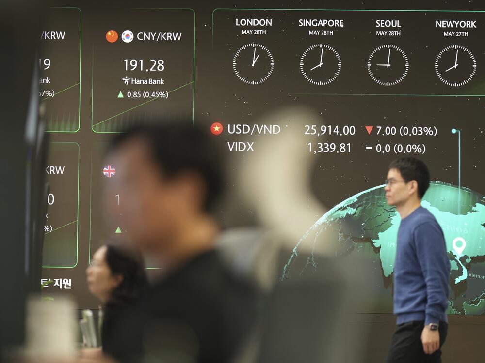 The screens show the foreign exchange rates at a dealing room of Hana Bank in Seoul, South Korea, on Wednesday.