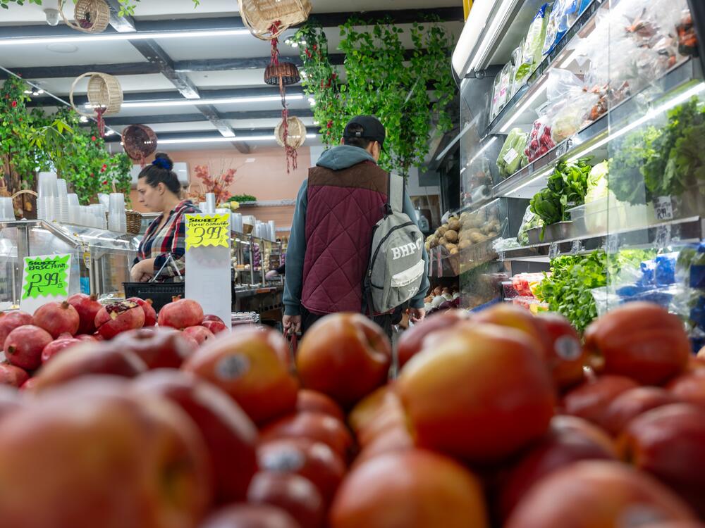 People shop for food in a Brooklyn neighborhood that has a large immigrant population on October 16, 2023 in New York City.