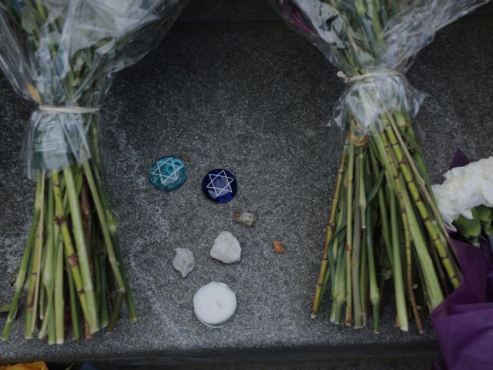 Flowers and stones are left outside the Lillian and Albert Small Capital Jewish Museum on May 23 in Washington, D.C.