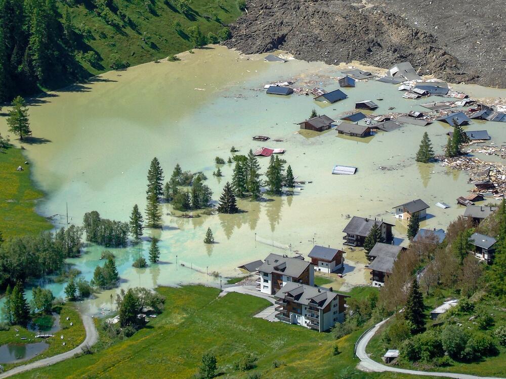The village of Blatten, in a valley below the Bietschhorn mountain in the Swiss Alps, was destroyed Wednesday by a landslide after part of the huge Birch Glacier collapsed. A local river is now blocked and forming a lake that is flooding buildings that remain, authorities said.
