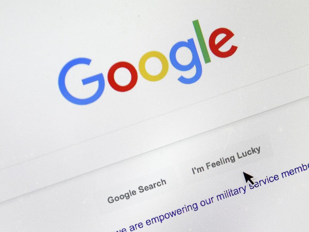 A cursor moves over Google's search engine page, in Portland, Ore., in 2018.