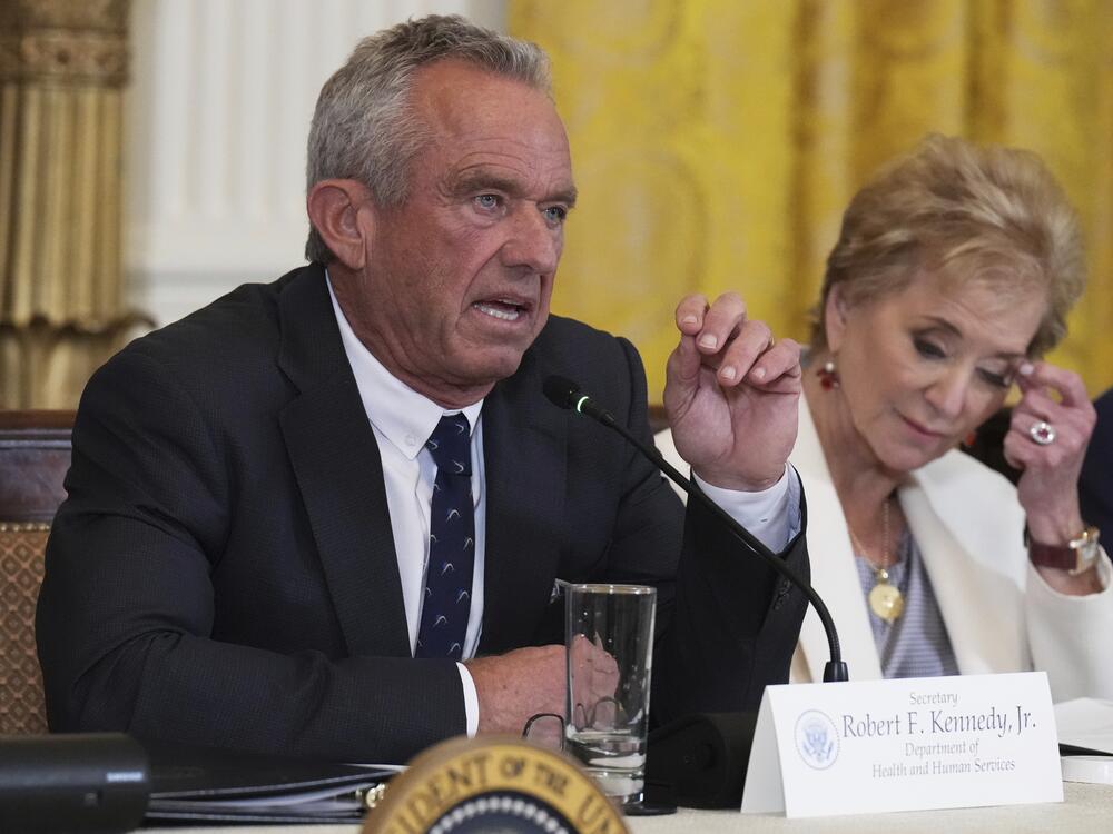 Health and Human Services Secretary Robert F. Kennedy Jr. speaks as Education Secretary Linda McMahon listens during a Make America Healthy Again (MAHA) Commission Event in the East Room of the White House, Thursday, May 22, 2025, in Washington.