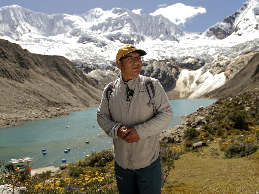 Saul Luciano Lliuya in front of Lake Palcacocha, located at 4,650 meters above sea level at the Huascaran National Park, in Huaraz, northeastern Peru, on May 23, 2022.