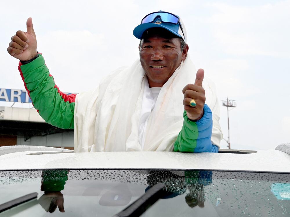 Mountaineer Kami Rita Sherpa broke his own record after climbing Mount Everest for the 31st time. He's seen here last year, acknowledging a crowd that celebrated his then-record 30th summit of Everest.