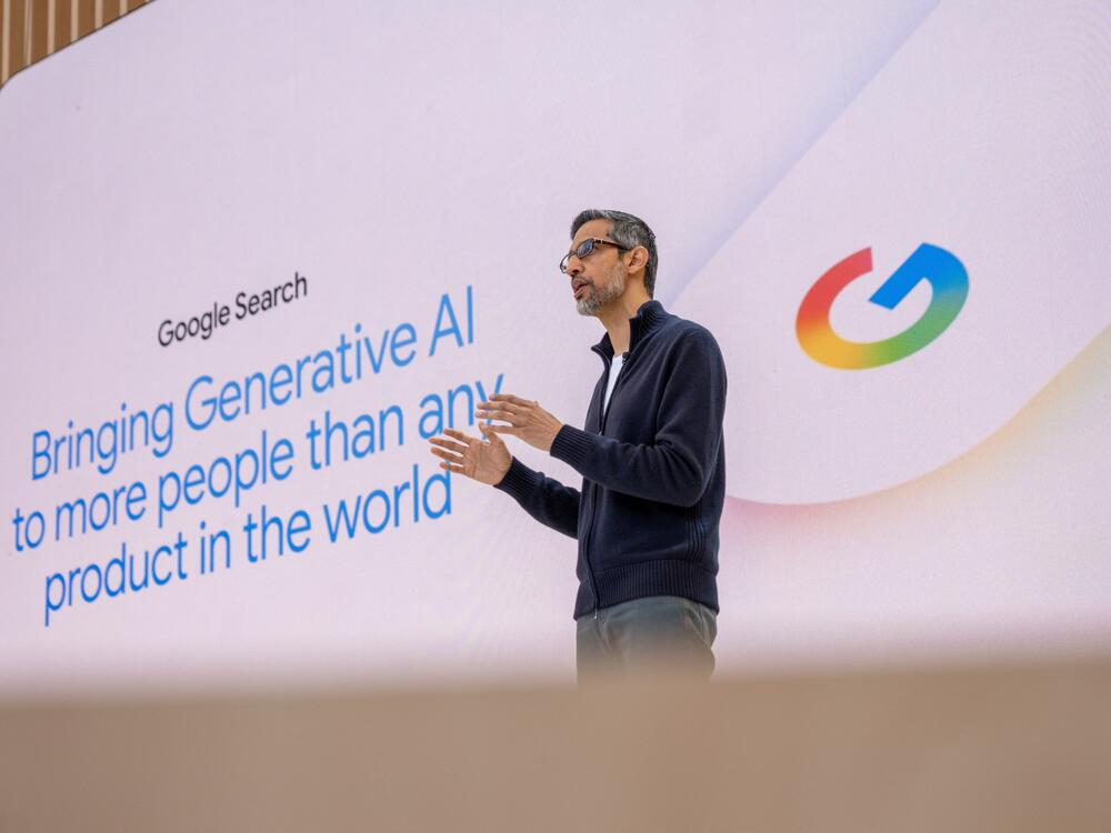 Google CEO Sundar Pichai addresses the crowd during Google's annual I/O developers conference in Mountain View, Calif., on May 20. AI has become a major piece of the government's concerns in Google's search engine monopoly case.