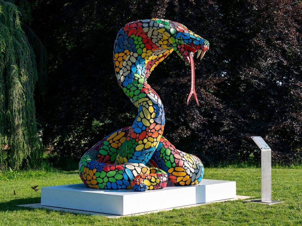 One of the snake statues on display in a park near Lake Geneva.