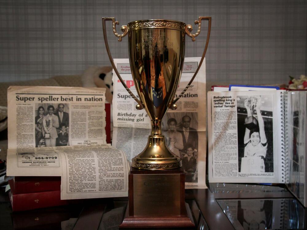 Balu Natarajan won the Scripps National Spelling Bee in 1985. Shown are his trophy and newspaper clippings detailing his win.
