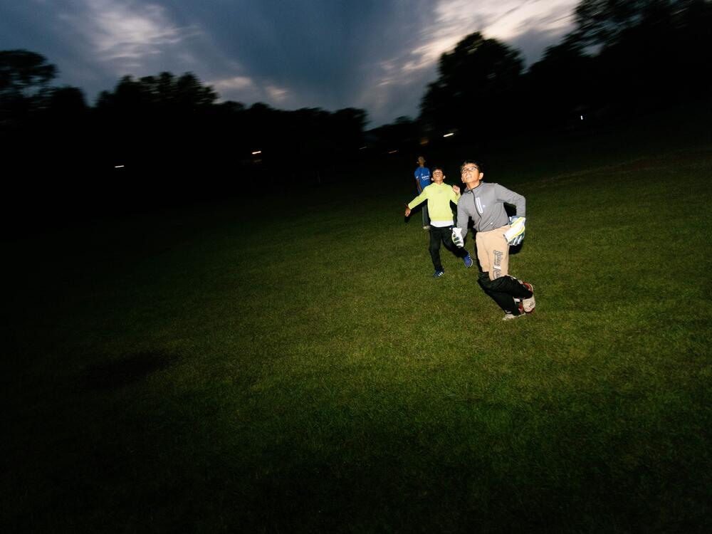 Children play catch with their cricket equipment on Sept. 30, 2024, after a practice for their Edison, N.J., neighborhood league had already ended.