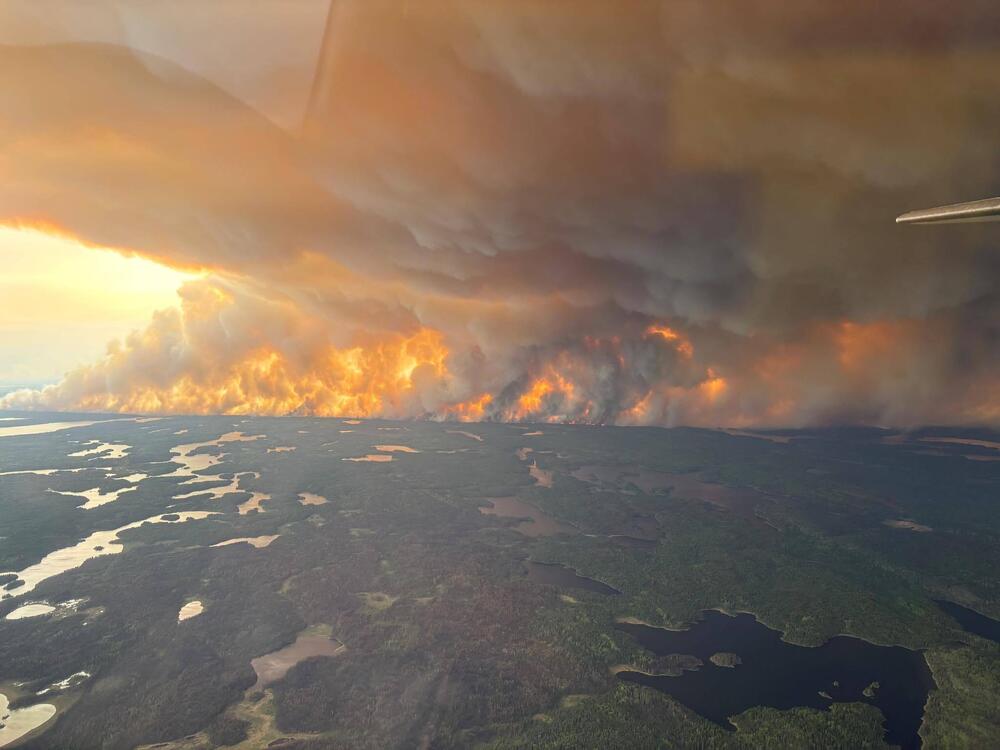 Clouds of wildfire smoke like this one in Flin Flon, Manitoba, are wafting into the Northern Plains and Midwest.