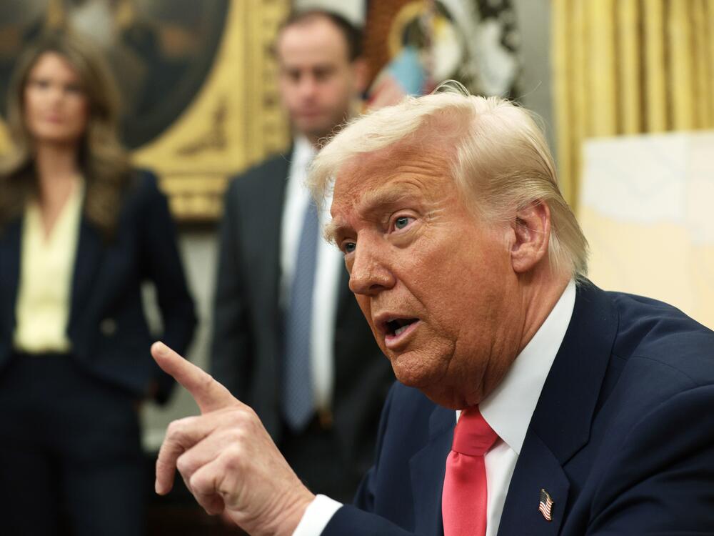 President Trump speaks after signing executive orders in the Oval Office in March 2025, including terminating the security clearances of those who work at the law firm Perkins Coie.