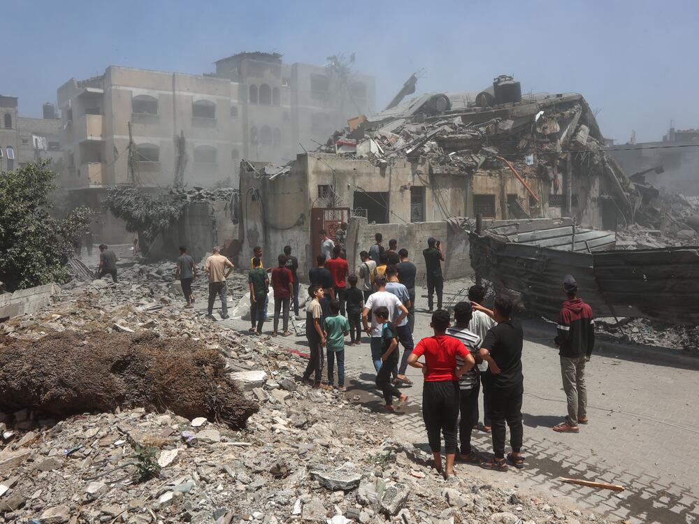 Palestinians inspect the rubble following Israeli strikes on in Gaza City on Saturday.