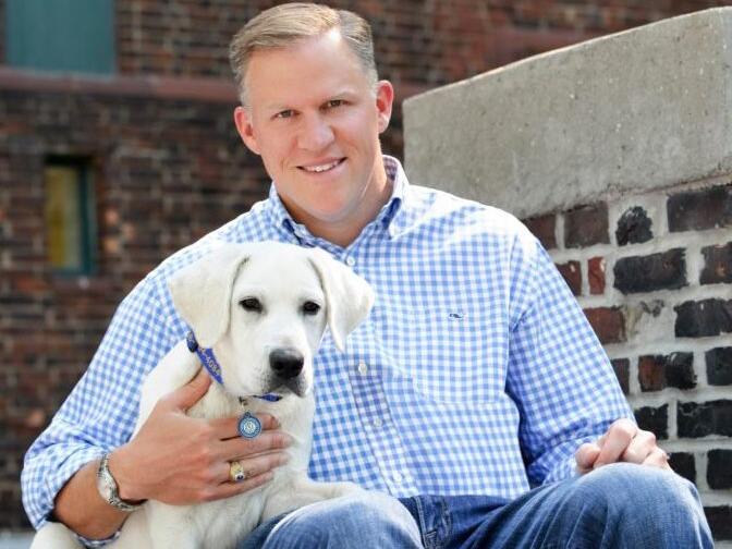 Barton O'Brien, shown with his dog Walter, runs the BAYDOG company, which sells harnesses, life-jackets and other pet supplies. He imports products from China, India and Vietnam, and double-digit tariffs have been challenging for his business.