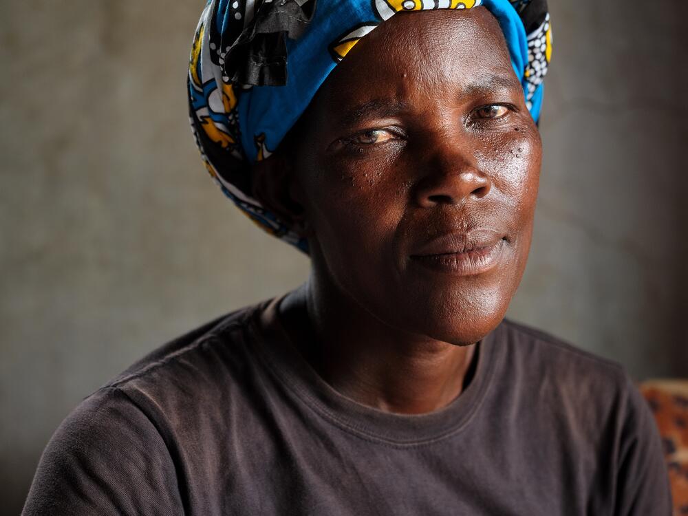 Naomy Akoth must walk 40 minutes each way to get her supply of HIV preventive drugs. Since the U.S. aid cuts the clinic is distributing fewer pills at each visit, causing her to worry.