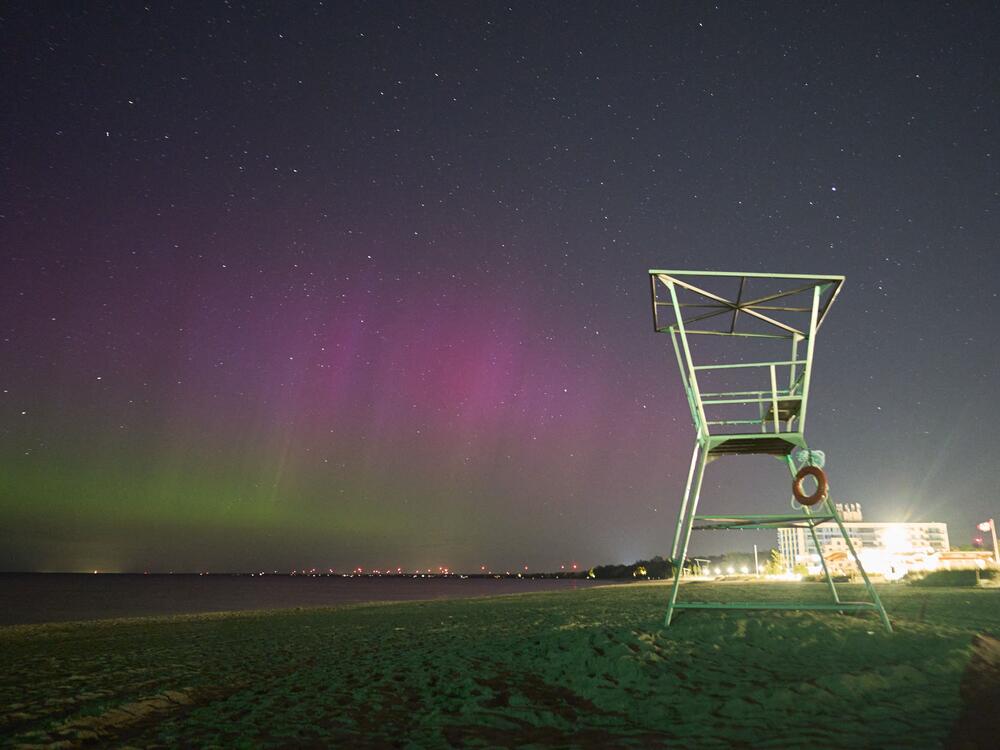The northern lights illuminate the night sky in Grand Bend, Ontario, Canada, during a geomagnetic storm on May 12, 2024.