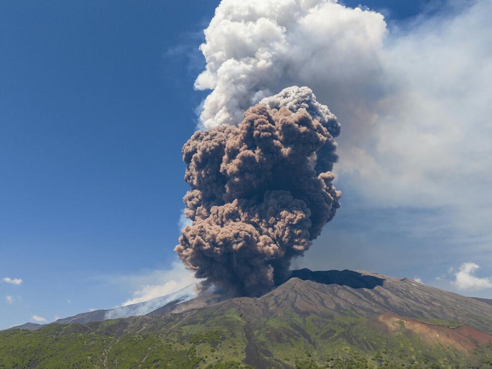 Smoke rises from the crater of the Etna volcano as it erupts, on Mount Etna near Catania, Italy, on Monday. A huge plume of ash, gas and rock spewed forth from Europe's highest active volcano.