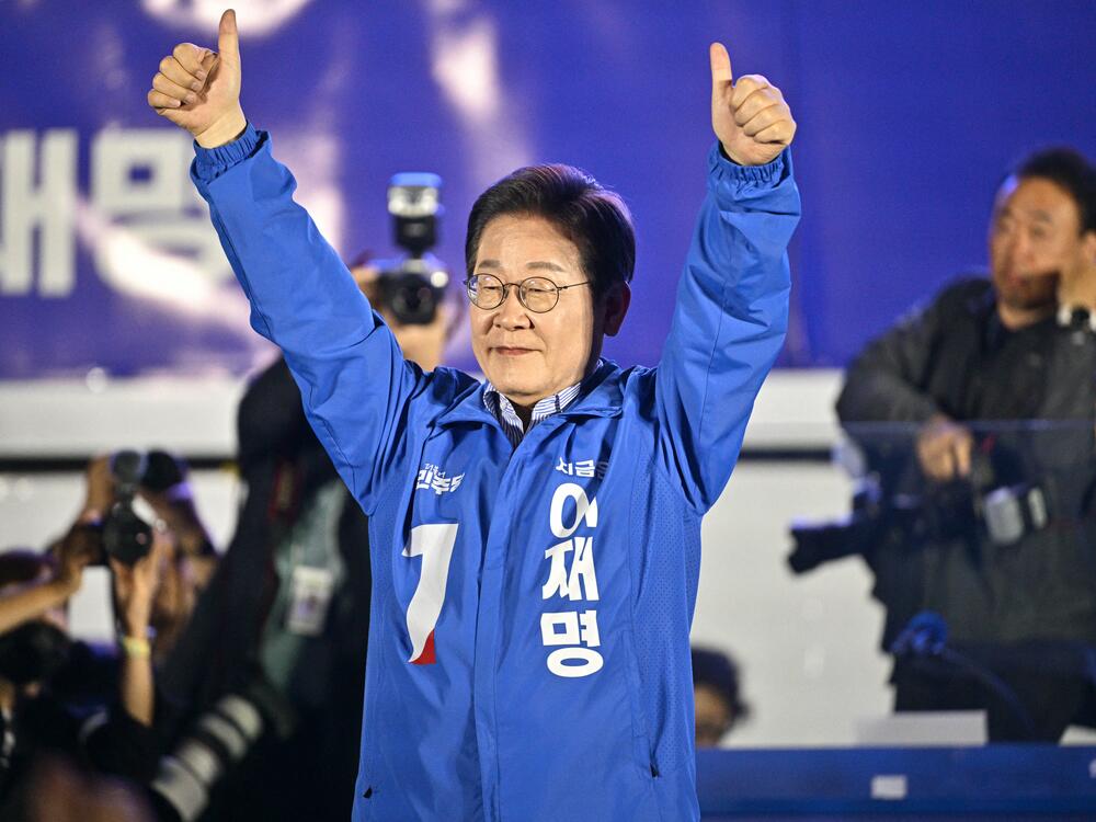 Lee Jae-myung, the presidential candidate for South Korea's Democratic Party, gestures onstage on Monday during his final election campaign event ahead of Tuesday's presidential election in Seoul.