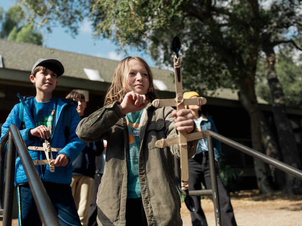 Campers take turns with slingshots at Project:Camp in Glendale, Calif.