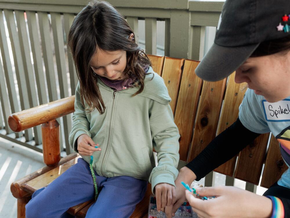 Campers and counselors make beaded bracelets together at Project:Camp in Glendale, Calif.