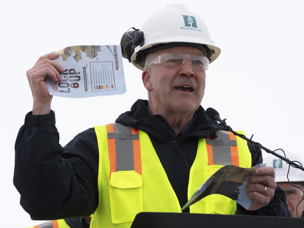 Sen. Dan Sullivan, R-Alaska, rips up a piece of paper that had plans from the Biden administration during a news conference at the Pump Station 1 on Monday, June 2, 2025, located near Deadhorse, Alaska, on the state's prodigious North Slope.